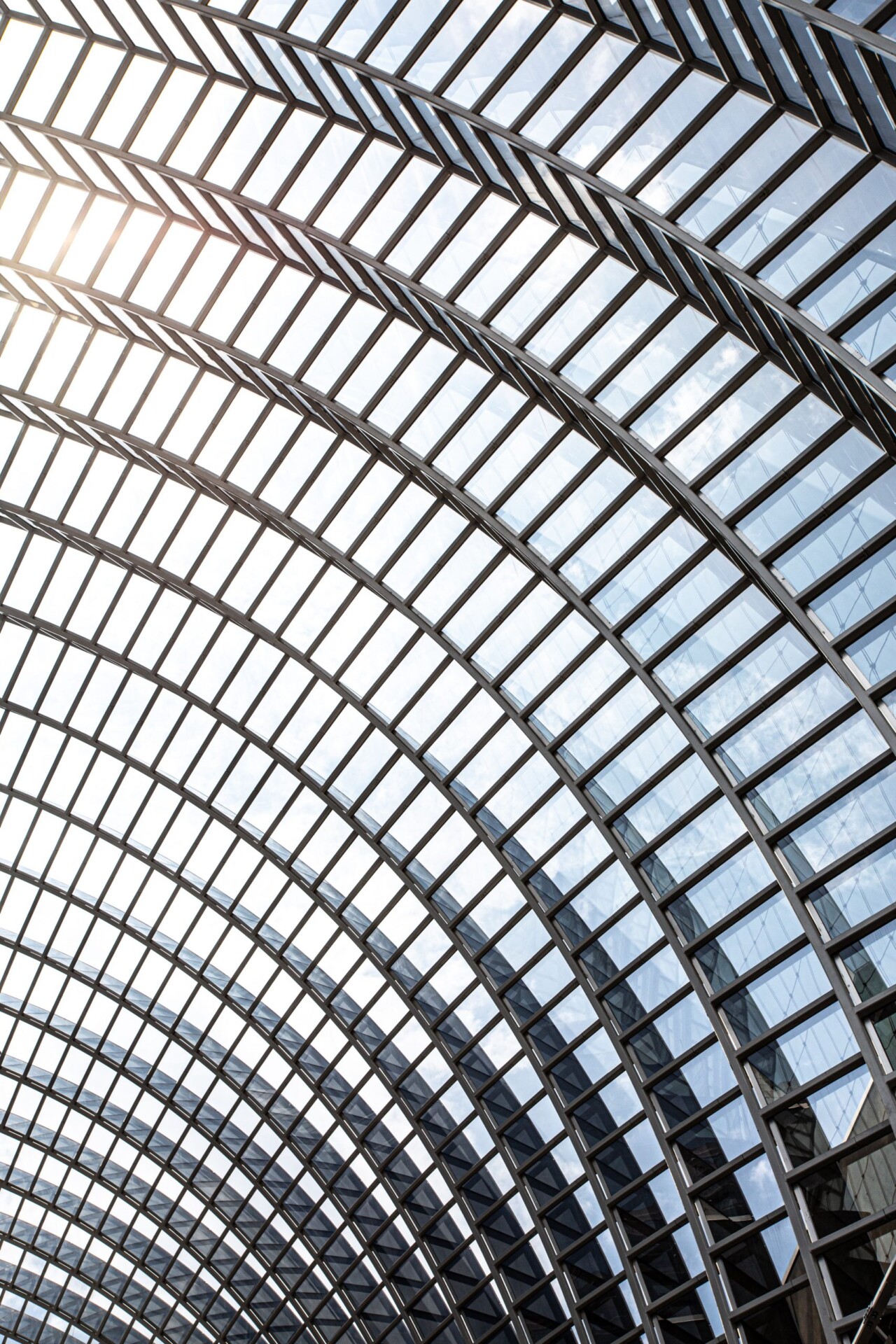 photo of a glass building that is curved with windows